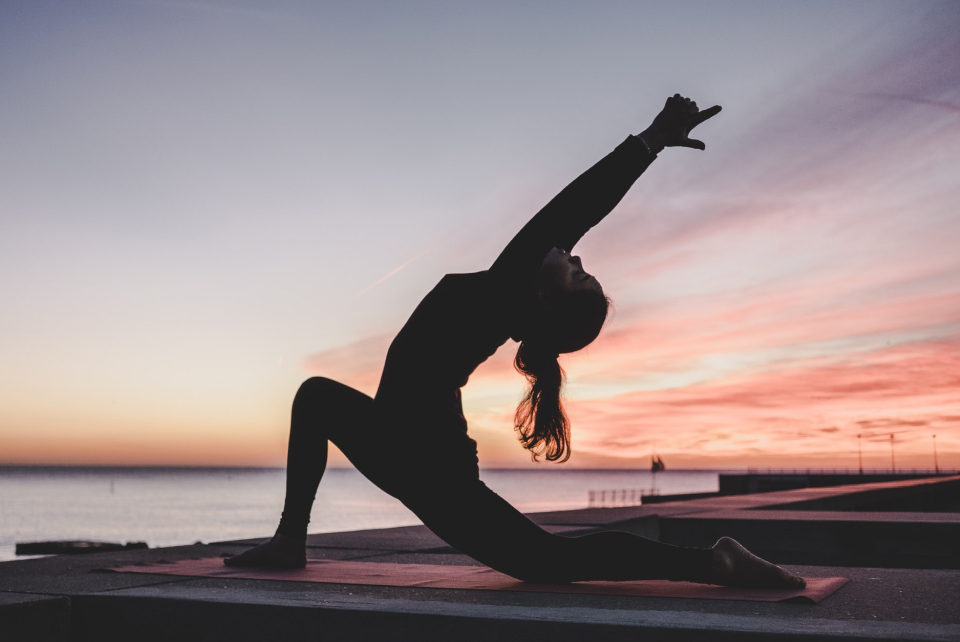 https://www.ohiospf.org/wp-content/uploads/2021/09/Woman-Doing-Yoga-At-Sunset.jpg